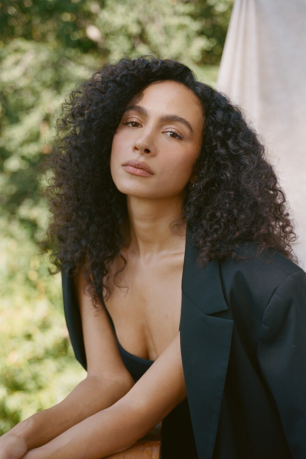 Netflix's Aurora Perrineau Shares the Secrets to How She Learned to Embrace  Her Curly Hair - S Magazine, image size:1000x1500